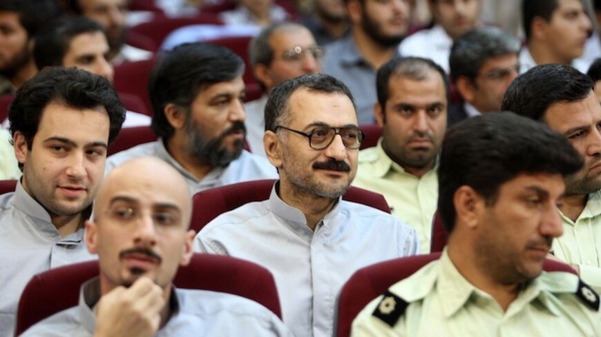 EDITORS' NOTE: Reuters and other foreign media are subject to Iranian restrictions on their ability to report, film or take pictures in Tehran. 

Political activist Shahabuldeen Tabatabai (bottom L) and  newspaper editor and political analyst Saeed Leylaz (C) sit as defendants accused of acting against national security in a courtroom in Tehran August 25, 2009.  Iran put prominent reformers in the dock on Tuesday, official media reported, in its fourth mass trial of people accused of orchestrating unrest af
