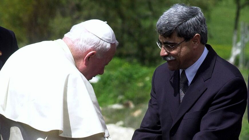 Nazareth Mayor Ramez Jarrisi bids farewall to Pope John Paul II, as the pontiff departs after giving mass at the Basilica of the Annunciation, in the birthplace of Jesus March 25. The pontiff was on the penultimate day of a six-day pilgrimage.
EH/GB - RTR2KBD