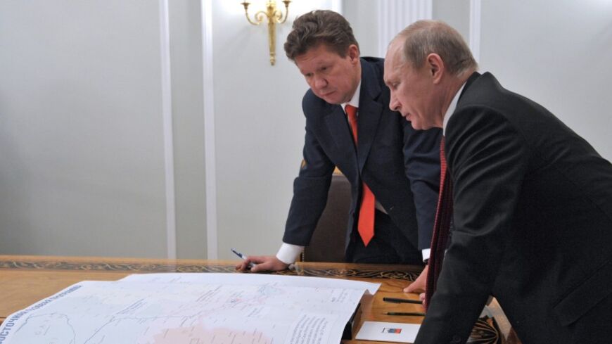 Russia's President Vladimir Putin (R) meets with Gazprom's Chief Executive Alexei Miller at the Novo-Ogaryovo residence outside Moscow, October 29, 2012. Russia's Gazprom pledged more than $38 billion (23.7 billion pounds) to develop an East Siberian gas field and build a pipeline to the Pacific port of Vladivostok to lessen its reliance on exports to Europe and develop Asian markets. REUTERS/Aleksey Nikolskyi/RIA Novosti/Pool (RUSSIA - Tags: POLITICS ENERGY BUSINESS) THIS IMAGE HAS BEEN SUPPLIED BY A THIRD