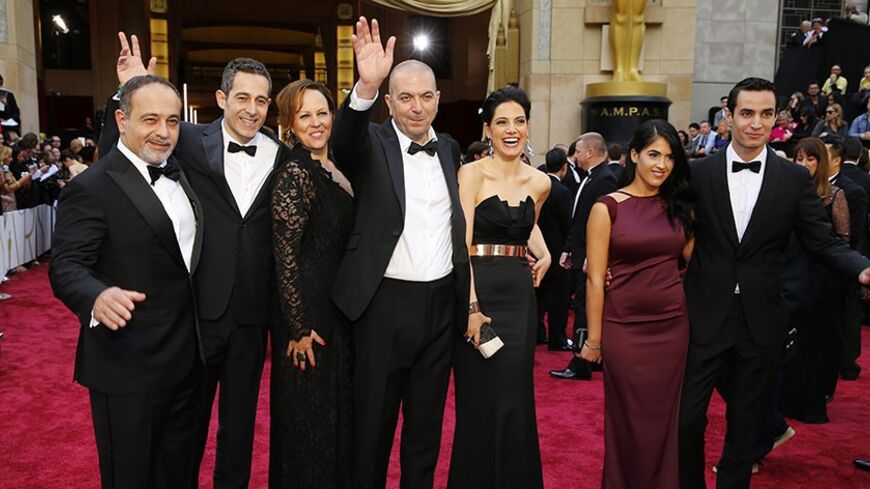 Hany Abu-Assad (C), Director Palestinian film "Omar" arrives with his cast at the 86th Academy Awards in Hollywood, California March 2, 2014. REUTERS/Mike Blake (UNITED STATES TAGS: ENTERTAINMENT) (OSCARS-ARRIVALS)
- RTR3FXFE