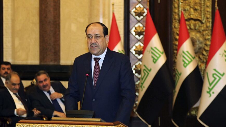 Iraqi Prime Minister Nouri al-Maliki speaks at the opening day of a counter-terrorism conference in Baghdad, March 12, 2014. REUTERS/Karim Kadim/Pool (IRAQ - Tags: POLITICS CIVIL UNREST) - RTR3GRM5