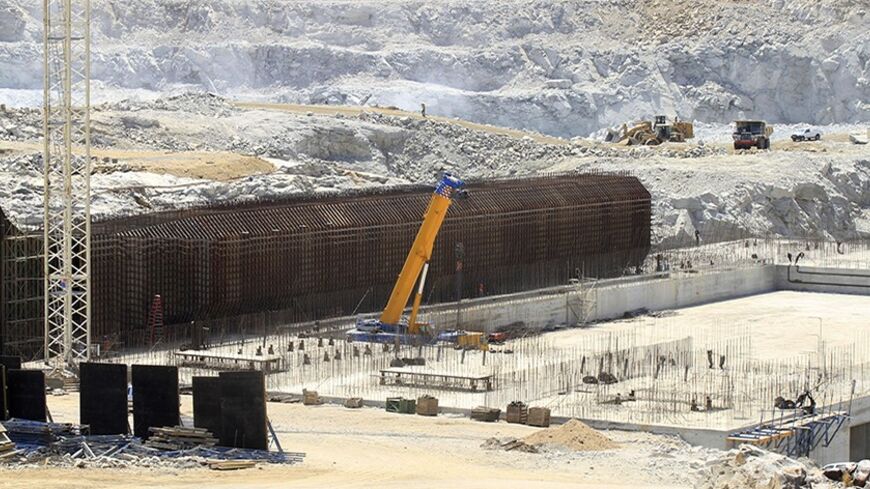 A general view shows construction activity on the Grand Renaissance dam in Guba Woreda, Benishangul Gumuz region March 16, 2014. Egypt fears the $4.7 billion dam, that the Horn of Africa nation is building on the Nile, will reduce a water supply vital for its 84 million people, who mostly live in the Nile valley and delta. Picture taken March 16, 2014. REUTERS/Tiksa Negeri (ETHIOPIA - Tags: ENERGY ENVIRONMENT POLITICS BUSINESS CONSTRUCTION) - RTR3HFPZ