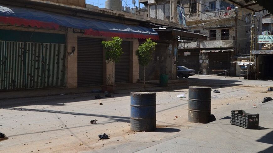 Bullet casings are seen on a deserted street in the Sunni Muslim Bab al-Tebbaneh neighbourhood in Tripoli, northern Lebanon March 21, 2014. Three people were killed in the northern Lebanese city of Tripoli on Friday in fighting between supporters and opponents of Syrian President Bashar al-Assad, security and medical sources said. Tripoli, like much of Lebanon, is divided along sectarian lines and is only 30 miles (50 km) from the Syrian border. Its majority Sunni Muslims, who back the Syrian rebels, often 
