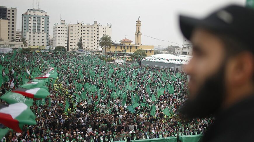 Supporters listen as Ismail Haniyeh, prime minister of the Hamas Gaza government, speaks during a Hamas rally marking the anniversary of the death of its leaders killed by Israel, in Gaza City March 23, 2014. REUTERS/Mohammed Salem (GAZA - Tags: POLITICS CIVIL UNREST ANNIVERSARY) - RTR3I86Q