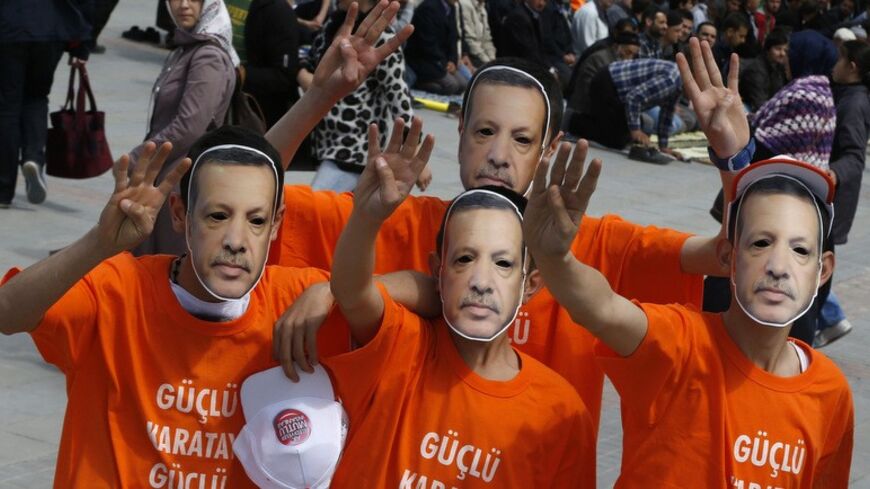 Supporters of the ruling AK Party wear Prime Minister Tayyip Erdogan masks during an election rally in Konya, central Turkey, March 28, 2014. Erdogan pulled out of election rallies in central Turkey on Friday in order to rest his voice after weeks of campaigning around the country, his office said. Erdogan had difficulty speaking at rallies in southeast Turkey on Thursday ahead of Sunday's local elections. Turkey will hold municipal elections on March 30. REUTERS/Umit Bektas (TURKEY - Tags: POLITICS ELECTIO