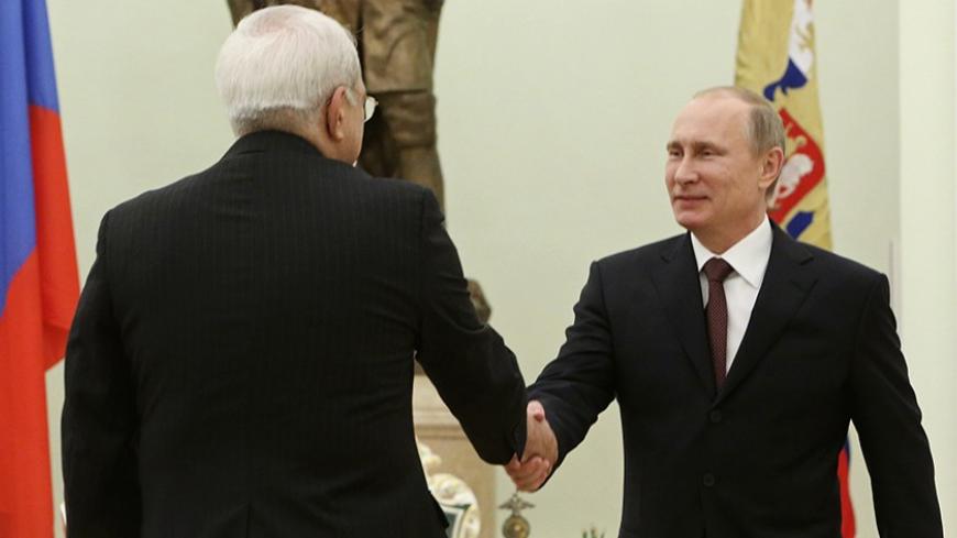 Russian President Vladimir Putin (R) meets with Iran's Foreign Minister Mohammad Javad Zarif in Moscow's Kremlin January 16, 2014. REUTERS/Sergei Karpukhin (RUSSIA - Tags: POLITICS) - RTX17GFB