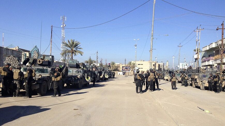 Iraqi SWAT troopers take part in an intensive security deployment during clashes with al Qaeda-linked Islamic State in Iraq and the Levant (ISIL) in the city of Ramadi, 100 km (62 miles) west of Baghdad, February 1, 2014. Iraqi troops and allied tribesmen killed 57 Islamist militants in Anbar province on Monday, the Defence Ministry said, in advance of a possible assault on the Sunni rebel-held city of Falluja. There was no independent verification of the toll among the militants, said to be members of the 