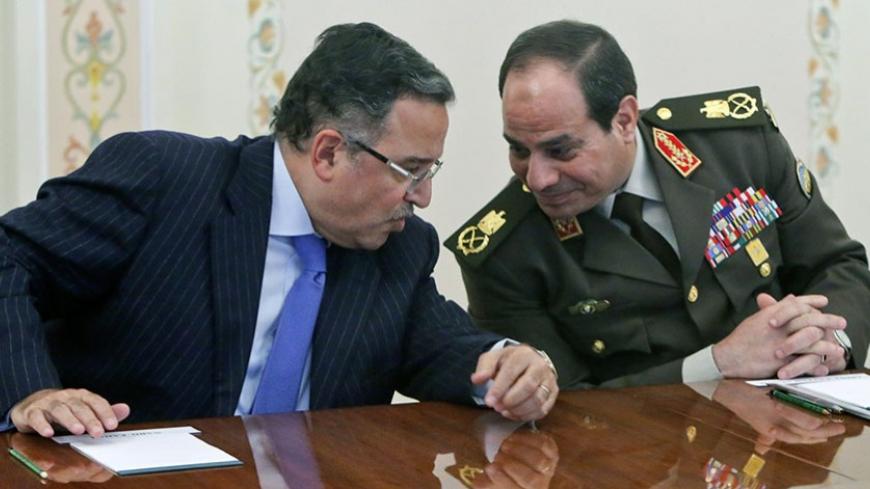 Egypt's Foreign Minister Nabil Fahmy (L) speaks with Army chief Field Marshal Abdel Fattah al-Sisi (R) during their meeting with Russian President Vladimir Putin at the Novo-Ogaryovo state residence outside Moscow, February 13, 2014. REUTERS/Maxim Shemetov (RUSSIA - Tags: POLITICS MILITARY) - RTX18QBK