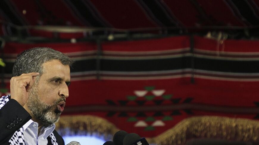 Ramadan Shallah, head of the militant Islamic Jihad group, delivers a speech during a rally to mark the 23nd anniversary of the group's founding held at a Palestinian refugee camp near Damascus November 5, 2010. REUTERS/Khaled al Hariri (SYRIA - Tags: ANNIVERSARY POLITICS) - RTXU9IG