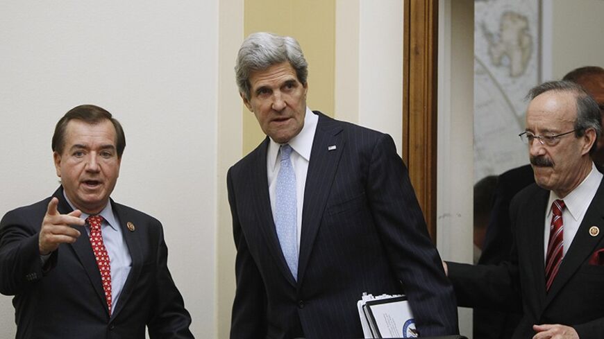 U.S. Secretary of State John Kerry (C) is escorted by Rep. Ed Royce (R-CA) (L), chairman of the House Foreign Affairs Committee, and Rep. Eliot Engel (D-NY) (R) before giving testimony on Capitol Hill in Washington April 17, 2013. REUTERS/Gary Cameron (UNITED STATES - Tags: POLITICS) - RTXYPB6