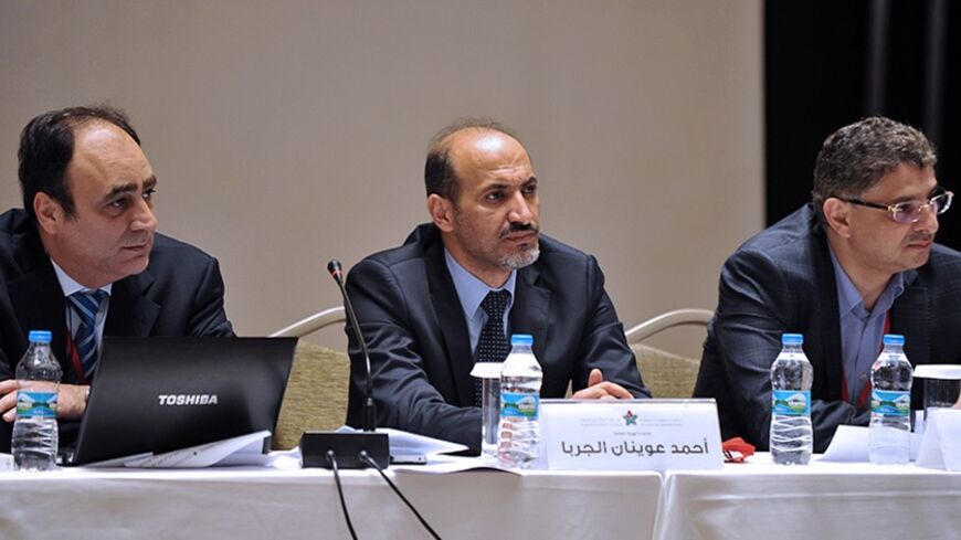 The chief of the Syrian National Council (SNC) Ahmad Jarba (C), the General Secretary of the Syrian National Council Bader Jamous (R) and member of the coalition Monzer Akbik (L) attend a meeting of the National Coalition of Syrian Revolution and Opposition forces on September 13, 2013, in Istanbul. AFP PHOTO / OZAN KOSE