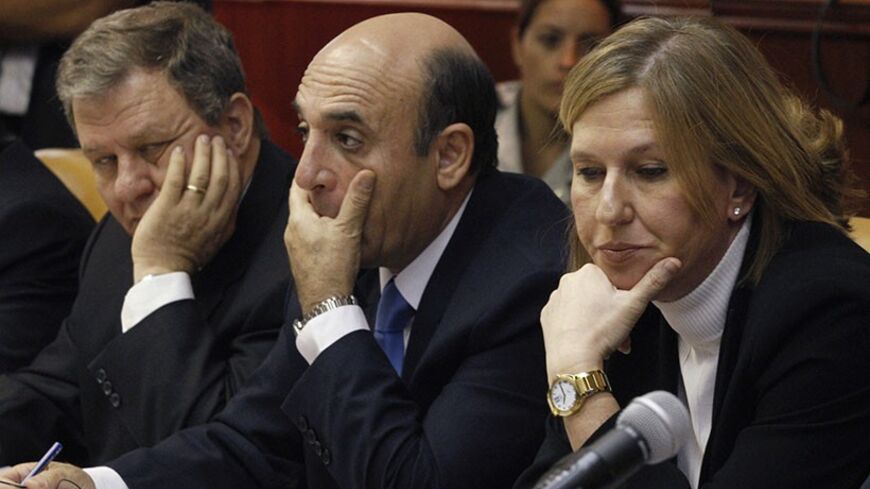 Israel's Foreign Minister Tzipi Livni, Transport Minister Shaul Mofaz (C) and Interior Minister Meir Sheetrit (L) attend the weekly cabinet meeting in Jerusalem September 14, 2008. Israel's cabinet debated for the first time on Sunday a proposal to offer compensation to Jewish settlers who volunteer to leave parts of the West Bank that would be handed to the Palestinians in a future peace deal.
REUTERS/Dan Balilty/Pool (JERUSALEM) - RTR21VED