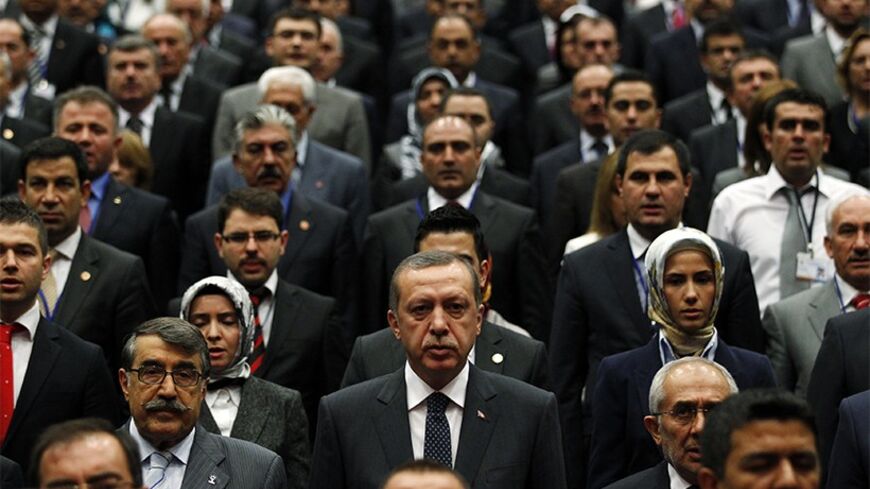 Turkey's Prime Minister Tayyip Erdogan (first row, C) attends a meeting with members of his ruling AK Party at his party headquarters in Ankara September 28, 2011. REUTERS/Umit Bektas (TURKEY - Tags: POLITICS TPX IMAGES OF THE DAY) - RTR2RXTQ