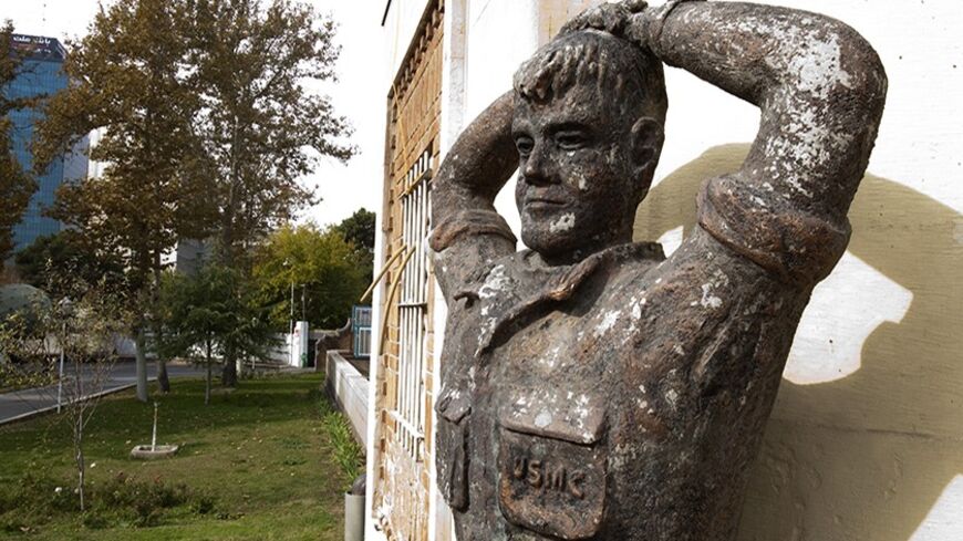 EDITORS' NOTE: Reuters and other foreign media are subject to Iranian restrictions on their ability to film or take pictures in Tehran.

A statue of a U.S. hostage is displayed in front of the main building of the former U.S. embassy in Tehran November 19, 2011. The former U.S. embassy was the site of the 1979-1981 hostage crisis in which a group of militant Iranian students held 52 U.S. diplomats hostage for 444 days. The building is currently being used by the Iranian Revolutionary Guards. REUTERS/Raheb H
