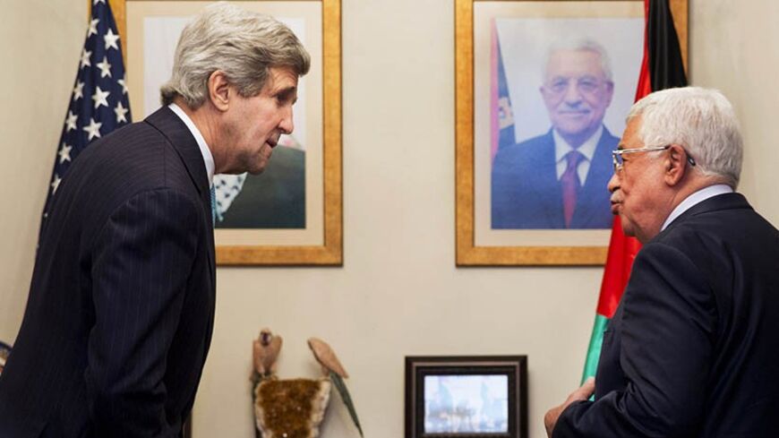 U.S. Secretary of State John Kerry (L), is greeted by Palestinian leader Mahmoud Abbas, during their meeting at the Palestinian Ambassador?s Residence in Amman, Jordan March 26, 2014. Kerry interrupted his Europe trip in an effort to salvage the Middle East peace talks as a breakdown looms. REUTERS/Jacquelyn Martin/Pool (JORDAN - Tags: POLITICS) - RTR3IPUV