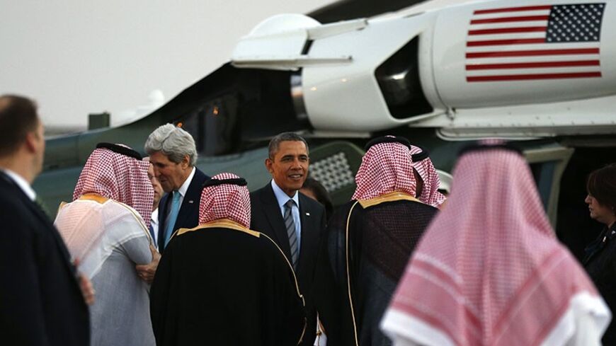 U.S. Secretary of State John Kerry (L) and U.S. President Barack Obama are greeted upon their arrival on Marine One for a meeting with Saudi King Abdullah at Rawdat al-Khraim (Desert Camp) near Riyadh in Saudi Arabia, March 28, 2014.
REUTERS/Kevin Lamarque (SAUDI ARABIA - Tags: POLITICS) - RTR3J176