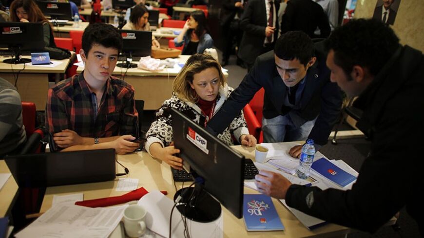 Volunteers work on the verification of election results at the main opposition Republican People's Party (CHP) headquarters in Ankara April 1, 2014. Turkey's main opposition CHP party said on Monday it would appeal against municipal election results in the capital Ankara where it suffered a narrow defeat at the hands of Turkish Prime Minister Tayyip Erdogan's AK Party (AKP) on Sunday. The AKP won 44.8 percent of the vote in Ankara to the CHP's 43.9 percent, according to provisional results on Turkish televi
