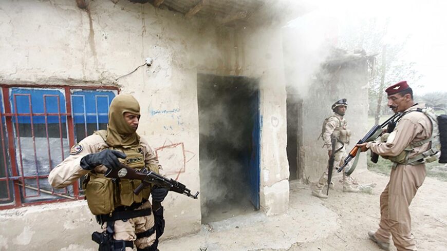 Iraqi security forces personnel are seen during clashes with the al Qaeda-linked Islamic State in Iraq and the Levant (ISIL) in Babel province south of Baghdad, April 2, 2014. Four members of the ISIL and one member of Iraqi security forces were killed during clashes, according to an Iraqi Army officer. REUTERS/Alaa Al-Marjani (IRAQ - Tags: CIVIL UNREST POLITICS CONFLICT) - RTR3JPFM