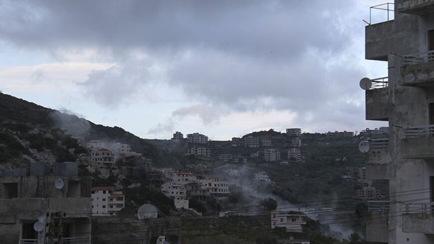 Smoke rises after what activists said was shelling by forces loyal to Syria's President Bashar al-Assad in the Armenian Christian town of Kasab April 7, 2014. For three years, residents of Syria's Mediterranean provinces have watched from their coastal sanctuary as civil war raging further inland tore the country apart, killing tens of thousands of people and devastating historic cities. But a three-week-old offensive by rebel fighters in the north of Latakia province, a bastion of Assad's Alawite minority,