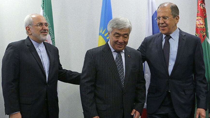 From R-L: Foreign Ministers Sergei Lavrov from Russia, Erlan Idrissov from Kazakhstan and Mohammad Javad Zarif from Iran gather for a family photo session during the Caspian Sea littoral states conference in Moscow, April 22, 2014. REUTERS/Maxim Shemetov (RUSSIA - Tags: POLITICS) - RTR3M69D