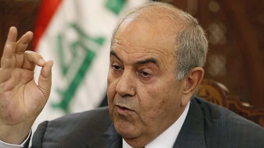 Former Iraqi Prime Minister Ayad Allawi speaks during an interview with Reuters in Baghdad, April 20, 2014. For Prime Minister Nouri al Maliki, a politician who saw himself as the one who rescued Iraq from civil war in the last decade, the current state of affairs amounts to a stunning reversal of fortune as Islamic State of Iraq and the Levant (ISIL) fighters inch towards the capital and Shiite militias he vanquished assert their influence again. Picture taken April 20, 2014. REUTERS/Thaier al-Sudani (IRAQ