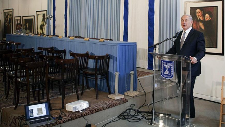 Israel's Prime Minister Benjamin Netanyahu delivers a statement in the Independence Hall of Israel in Tel Aviv May 1, 2014. Netanyahu said on Thursday he would seek to enact a law to define Israel as a Jewish state, a step certain to raise opposition from Arab citizens who make up a fifth of the population. REUTERS/Dan Balilty/Pool (JERUSALEM - Tags: POLITICS) - RTR3NETY