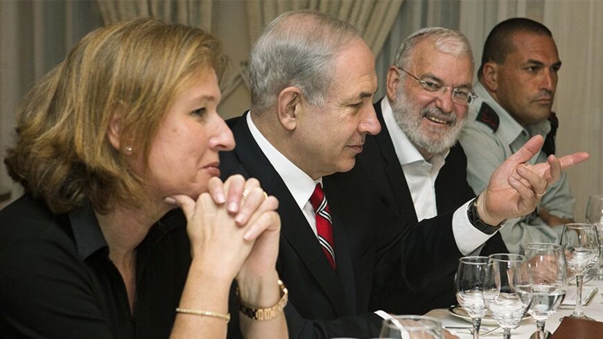 Israel's Prime Minister Benjamin Netanyahu (2nd L), flanked by Tzipi Livni (L), Israel's chief negotiator with the Palestinians, National Security Adviser Yaakov Amidror (3rd L) and Military Secretary Eyal Zamir, speaks with U.S. Secretary of State John Kerry (not pictured) during a meeting in Jerusalem June 29, 2013. Kerry extended his Middle East peace mission on Saturday, shuttling between Jerusalem and Amman for more talks with Israeli and Palestinian leaders on reviving their stalled negotiations. REUT