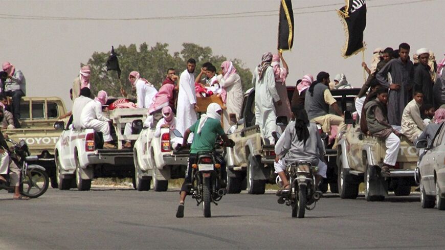 A funeral convoy carrying the bodies of four Islamist militants, drives through Sheikh Zuweid, in the north of the Sinai peninsula August 10, 2013. The four Islamist militants were killed by an air strike that their comrades said had been done by an Israeli drone but which state media said was the work of an Egyptian army helicopter. REUTERS/ Stringer (EGYPT - Tags: CIVIL UNREST POLITICS) - RTX12G57