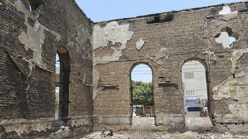 The burnt and destroyed Evangelical Church are seen in Mallawi at Minya governorate, about 245 km (152 miles) south of Cairo August 17, 2013. Egypt's Coptic Christians, who make up 10 percent of its 85 million people, have coexisted with the majority Sunni Muslims for centuries. Violence erupted periodically, especially in the impoverished south, but the attacks on churches and Christian properties in the last week are the worst in years. Picture taken August 17, 2013.  To match INSIGHT EGYPT-PROTESTS/CHURC