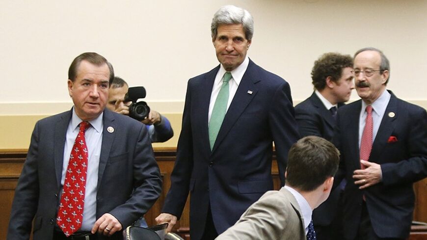 U.S. Secretary of State John Kerry (C) arrives with Committee Chairman U.S. Representative Ed Royce (R-CA) (L) and ranking member Representative Eliot Engel (D-NY) (R) to testify on agreements over Iran's nuclear programs, before the House Foreign Affairs Committee on Capitol Hill in Washington, December 10, 2013. REUTERS/Jonathan Ernst    (UNITED STATES - Tags: POLITICS MILITARY) - RTX16CKP