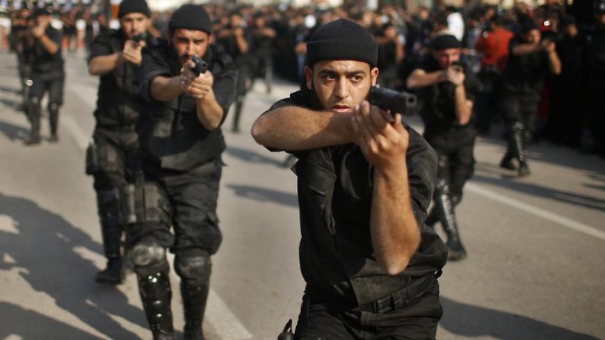 Members of the Palestinian security forces loyal to Hamas movement take part in a parade marking the fifth anniversary of the three-week offensive Israel launched in 2008-2009, in Gaza City January 13, 2014. REUTERS/Mohammed Salem (GAZA - Tags: POLITICS ANNIVERSARY MILITARY) - RTX17CGC