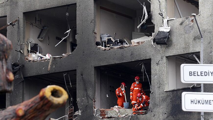 Search and rescue team members work on one of the scenes of the twin car bomb attacks in the town of Reyhanli of Hatay province near the Turkish-Syrian border May 12, 2013. Twin car bombs killed 43 people and wounded many more in a Turkish town near the Syrian border on Saturday and the government said it suspected Syrian involvement. The bombing increased fears that Syria's civil war was dragging in neighbouring states despite renewed diplomatic moves towards ending two years of fighting in which more than