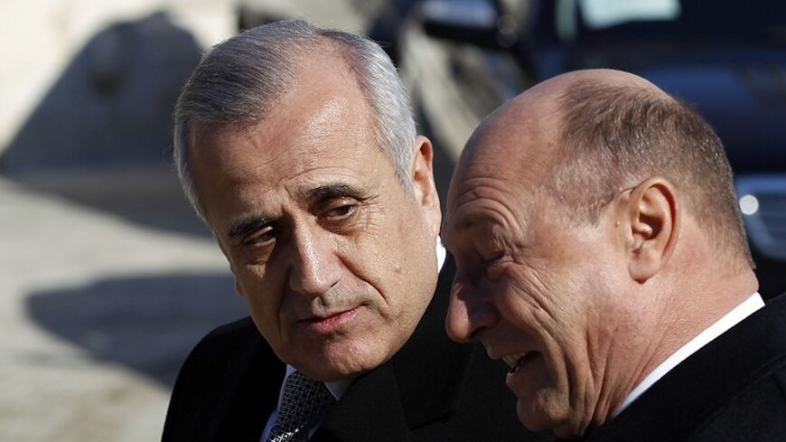 Romania's President Traian Basescu (R) walks with Lebanon's President Michel Suleiman during an official welcoming ceremony at Cotroceni palace in Bucharest February 28, 2012. President Suleiman is on a three-day official visit to Romania. REUTERS/Bogdan Cristel (ROMANIA  - Tags: POLITICS) - RTR2YKF8