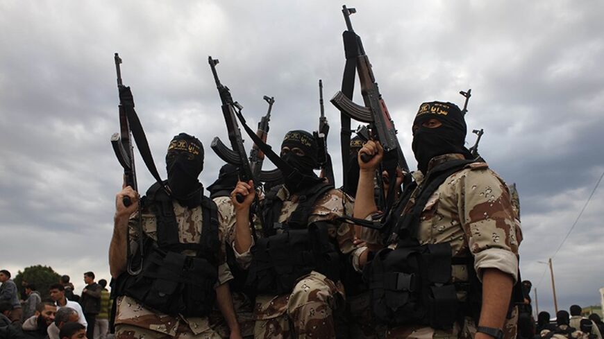 Islamic jihad militants take part in the funeral of three comrades, who were killed in an Israeli air strike, in Khan Younis in the southern Gaza Strip March 11, 2014. An Israeli air strike on Tuesday killed three Palestinian militants in the Gaza Strip, the Islamic Jihad group said. The Israeli military said an Israeli aircraft targeted Islamic Jihad members who had fired a mortar bomb at its forces, and "direct hits were confirmed". REUTERS/Ibraheem Abu Mustafa (GAZA - Tags: POLITICS CIVIL UNREST) - RTR3G