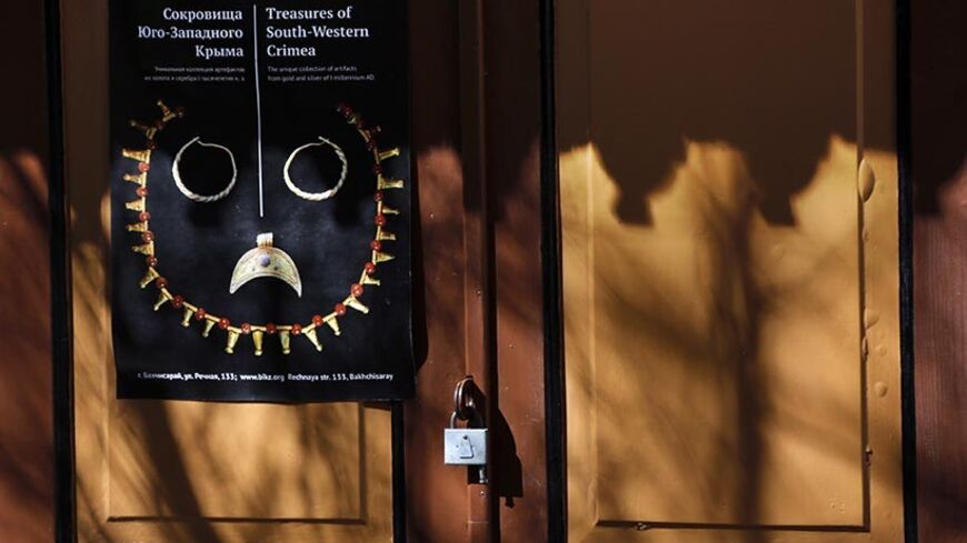 A sign is pictured inside the 16th-century Tatar Khans' palace in Bakhchisaray April 2, 2014. From the 16th-century Tatar Khans' palace in Bakhchisaray to the former tsarist residence that hosted the World War Two Yalta conference, Crimea's heritage sites have become a source of bitter contention since Russia seized the region from Ukraine. REUTERS/Yannis Behrakis (UKRAINE - Tags: TRAVEL SOCIETY) - RTR3JPF8