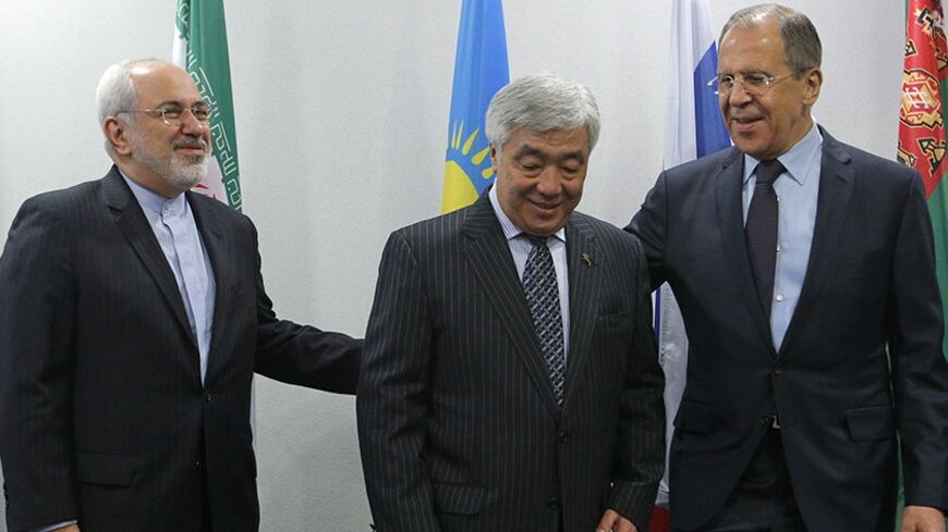 From R-L: Foreign Ministers Sergei Lavrov from Russia, Erlan Idrissov from Kazakhstan and Mohammad Javad Zarif from Iran gather for a family photo session during the Caspian Sea littoral states conference in Moscow, April 22, 2014. REUTERS/Maxim Shemetov (RUSSIA - Tags: POLITICS) - RTR3M69D