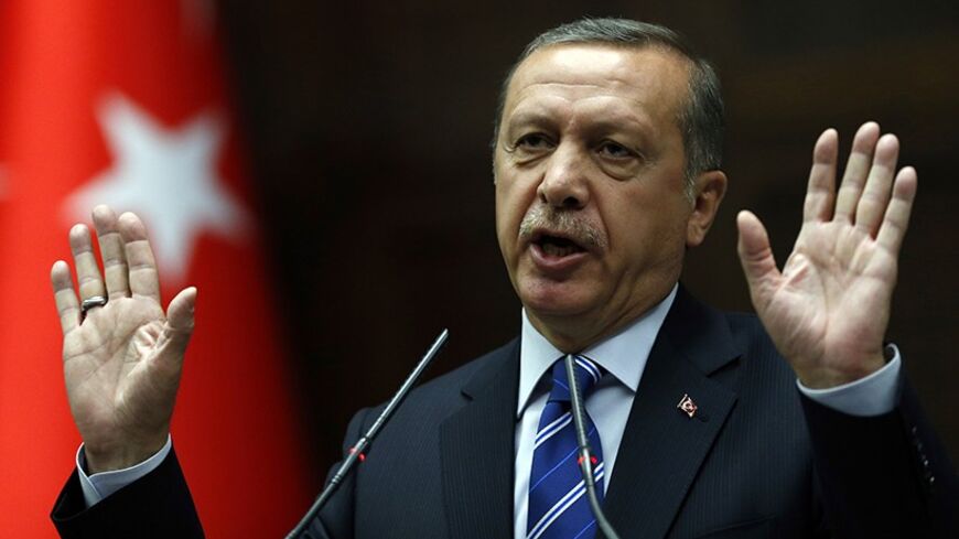Turkey's Prime Minister Tayyip Erdogan addresses members of parliament from his ruling AK Party (AKP) during a meeting at the Turkish parliament in Ankara April 29, 2014. REUTERS/Umit Bektas (TURKEY - Tags: POLITICS) - RTR3N1YE