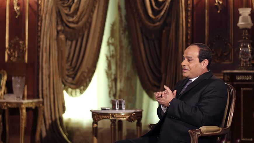 Egypt's presidential candidate and former army chief Abdel Fattah al-Sisi, speaks during an interview with Reuters in Cairo May 14, 2014. Abdel Fattah al-Sisi, the general who ousted an elected Islamist president and is set to become Egypt's next head of state, called on the United States to help fight jihadi terrorism to avoid the creation of new Afghanistans in the Middle East. Picture taken May 14, 2014. REUTERS/Amr Abdallah Dalsh (EGYPT - Tags: POLITICS ELECTIONS MILITARY) - RTR3P9BN