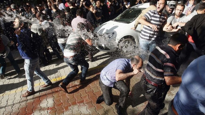 Police use water cannons against protesters as they demonstrate to blame the ruling AK Party (AKP) government for the mining disaster in Soma, a district in Turkey's western province of Manisa May 16, 2014. Turkish police fired water cannon and tear gas on Friday to disperse a crowd of several thousand protesters in the town of Soma, where close to 300 people died in the country's worst ever mining disaster this week, a Reuters witness said.     REUTERS/ Stringer (TURKEY - Tags: DISASTER ENERGY CIVIL UNREST