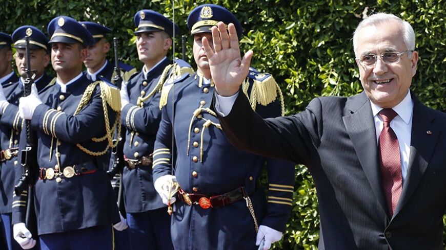 Outgoing Lebanese President Michel Sleiman gestures beside his wife during his farewell ceremony at the presidential palace in Baabda, near Beirut May 24, 2014. REUTERS/Mohamed Azakir  (LEBANON - Tags: POLITICS) - RTR3QNBY