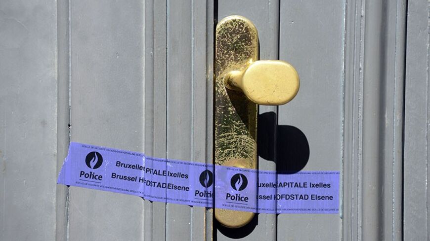 A police tape is seen over the entrance of the Jewish Museum, the site of a shooting incident, in central Brussels, May 25, 2014. Two women and a man were killed and one person seriously injured during a shooting at the Jewish Museum in central Brussels on Saturday, with Belgian officials saying anti-Semitic motives could not be ruled out.        REUTERS/Eric Vidal (BELGIUM  - Tags: CRIME LAW) - RTR3QQRS