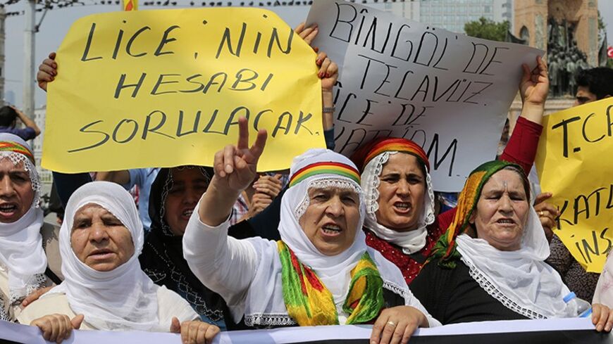 Protesters shout slogans during a demonstration against Turkish security forces, after an incident in the Lice district of Diyarbakir province killed one person and wounded seven on Friday, in Istanbul June 29, 2013. Turkish security forces killed one person and wounded seven on Friday when they fired on a group of people protesting against construction of a new gendarmerie outpost in Kurdish-dominated southeastern Turkey, security sources said. The incident happened in the village of Kayacik in the Lice di