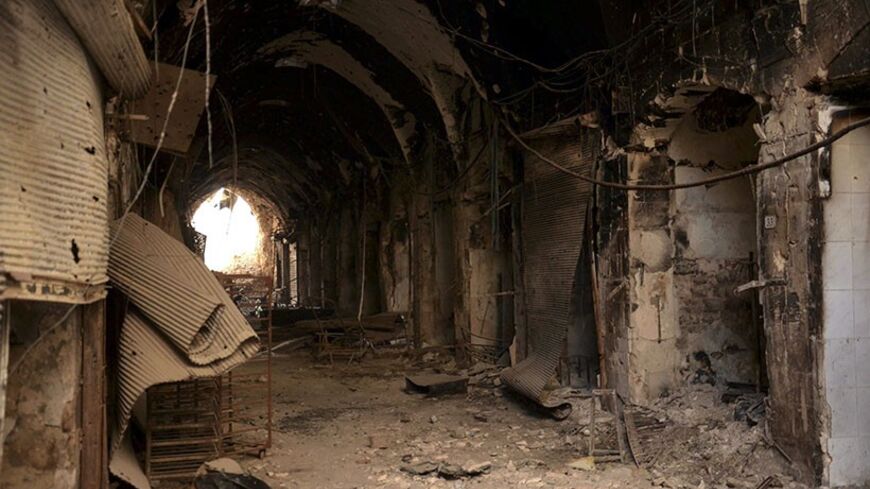 Damage and debris is seen in the souks of Old Aleppo, November 23, 2013. The Syrian army loyal to President Bashar al-Assad took control of the souk surrounding the Umayyad Mosque that was previously dominated by Free Syrian Army fighters, they said. Some of the areas recaptured are the gold market, Souk Khairat Beck, Alzerb market and the Wali bil Maarouf shrine.  REUTERS/George Ourfalian (SYRIA - Tags: POLITICS CIVIL UNREST CONFLICT) - RTX15Q1O