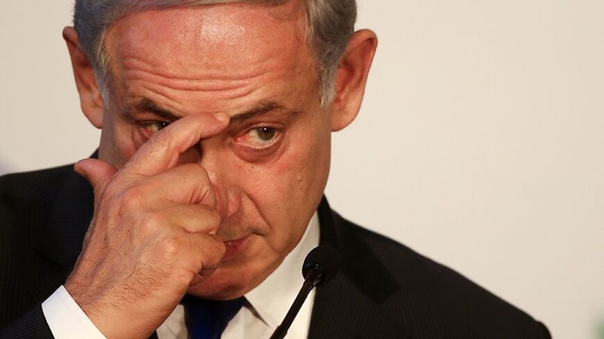 Israeli Prime Minister Benjamin Netanyahu listens to a question during a joint news conference with his Italian counterpart Enrico Letta at the end of a bilateral meeting at Villa Madama in Rome December 2, 2013.  REUTERS/Alessandro Bianchi  (ITALY - Tags: POLITICS) - RTX1616K