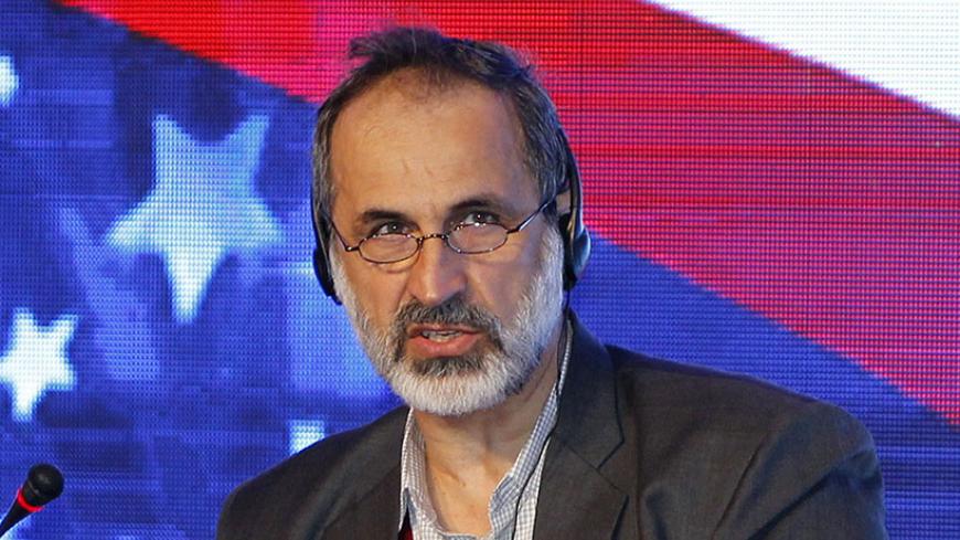Mouaz al-Khatib, Former President of the National Coalition for Syrian Revolutionary and Opposition Forces speaks during the 11th US-Islamic World Forum, in Doha, on June 10, 2014. This years Forum is entitled Islam and Inclusion focuses on challenges of inclusion within Muslim communities around the world, especially in the context of governance, academia, religious institutions and civil society. The US-Islamic World Forum is a Brookings Institutions Project on U.S. Relations with the Islamic World, in pa
