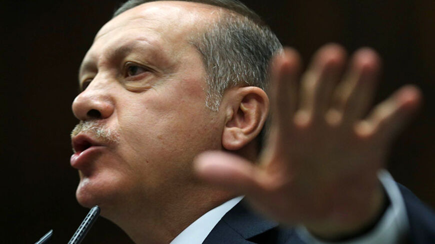 Turkey's Prime Minister Recep Tayyip Erdogan addresses members of the parliament of his ruling AK Party (AKP) during a meeting at the Turkish Parliament in Ankara on June 24, 2014. AFP PHOTO/ADEM ALTAN        (Photo credit should read ADEM ALTAN/AFP/Getty Images)