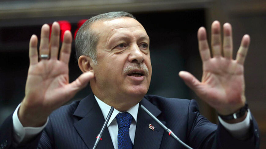 Turkey's Prime Minister Recep Tayyip Erdogan addresses members of his ruling AK Party (AKP) during a meeting at the Turkish Parliament in Ankara on June 3, 2014. Erdogan is set to announce his candidature for presidential elections in August despite deepening concern over his polarising rule. Already in his third term as prime minister -- the maximum permitted under his Justice and Development Party (AKP)'s rules -- Erdogan has made no secret of his ambition to run for president.    AFP PHOTO/ADEM ALTAN    