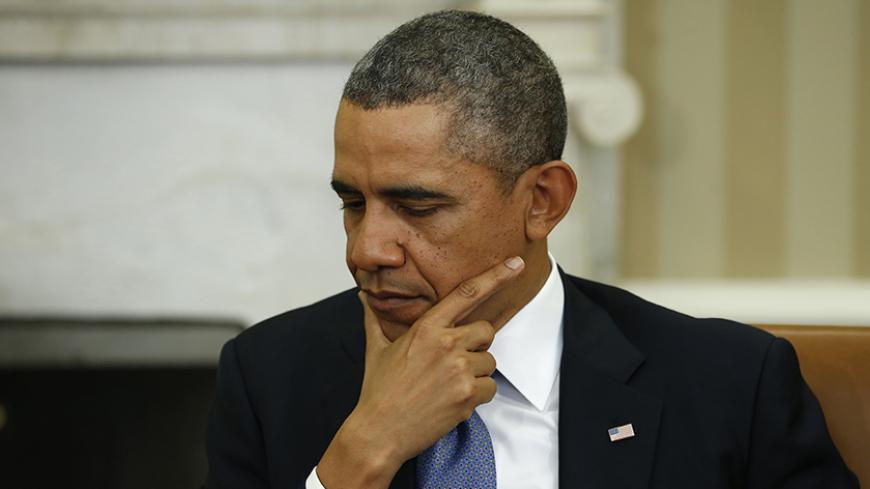 U.S. President Barack Obama listens to remarks during his meeting with Palestinian Authority President Mahmoud Abbas at the White House in Washington March 17, 2014. President Barack Obama on Monday urged Palestinian President Mahmoud Abbas to make tough decisions and take risks for peace with Israel, saying he hoped to see progress in U.S.-brokered negotiations in coming weeks.
REUTERS/Kevin Lamarque (UNITED STATES - Tags: POLITICS) - RTR3HG4C