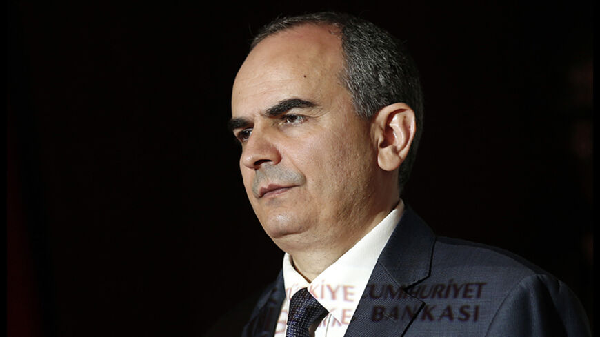 Turkey's central bank governor Erdem Basci addresses the general assembly of the bank in Ankara April 17, 2014. Turkey's current account deficit to gross domestic product (GDP) ratio was expected to be between 5-6 percent at the end of 2014, Basci said on Thursday.   REUTERS/Umit Bektas (TURKEY - Tags: POLITICS BUSINESS HEADSHOT) - RTR3LO4I
