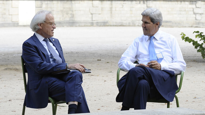 U.S. Secretary of State John Kerry (R) and U.S. Special Envoy for Israeli-Palestinian negotiations Martin Indyk talk in Les Tuilleries in Paris September 8, 2013. REUTERS/Susan Walsh/Pool (FRANCE - Tags: POLITICS) - RTX13CU4
